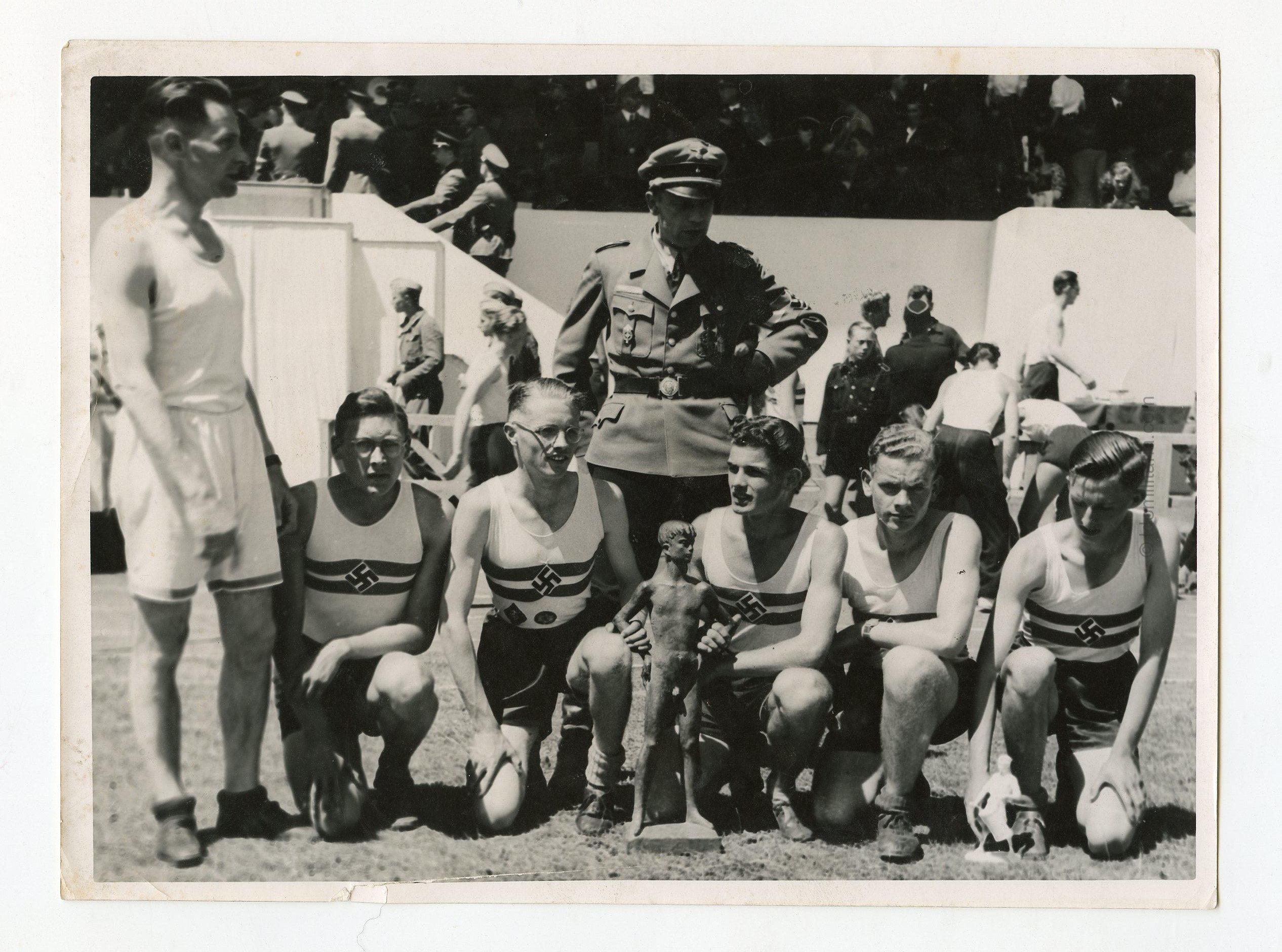 Original WWII-Era Press Photograph – German Track Athletes with Trophy Presentation